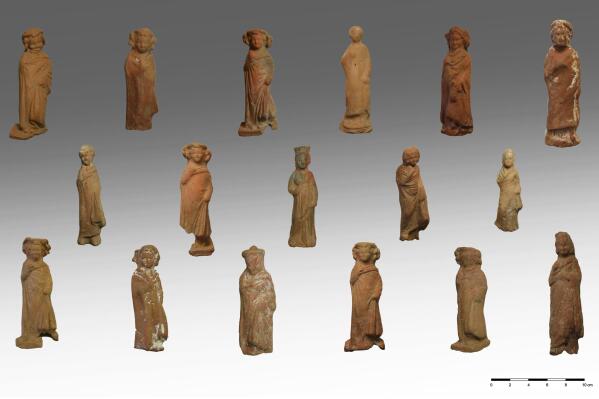 In this undated photo released by the Greek Culture Ministry, on Wednesday, June 7, 2023, clay figurines of boys and girls found during an excavation on the Greek island of Kythonos. Archaeologists excavating a hilltop sanctuary on the Aegean Sea island of Kythnos have discovered “countless” pottery offerings left there by ancient worshippers over the centuries, Greece's Culture Ministry said Wednesday, June 7, 2023. (Greek Culture Ministry via AP)
