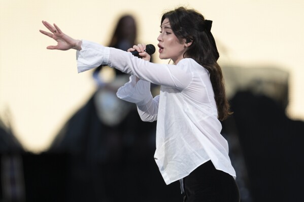 FILE - Gracie Abrams performs as the opening act for Taylor Swift's "The Eras Tour" in Nashville, Tenn., on May 5, 2023. Abrams is nominated for a Grammy Award for best new artist. (AP Photo/George Walker IV, File)