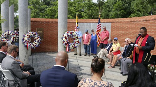 The Rev. John Crestwell , right, speaks during a wreath-laying ceremony at the Guardians of the First Amendment Memorial, Wednesday, June 28, 2023 in Annapolis, Md., on the fifth anniversary of the shooting at the Capital Gazette newsroom that killed five people in 2018. (AP Photo/Brian Witte)