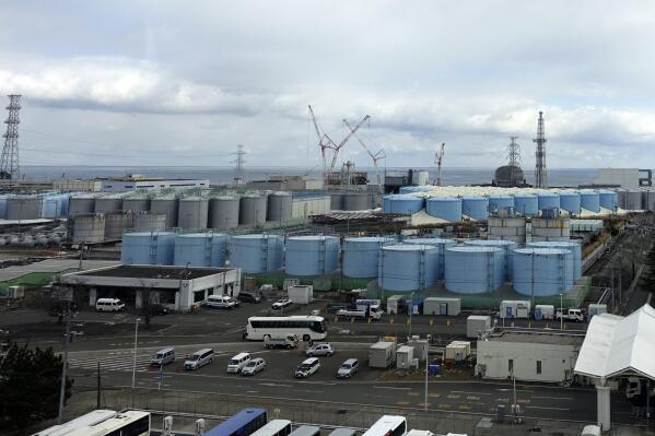 This photo taken during a visit by Associated Press journalists shows some of about 1,000 huge tanks holding treated but still radioactive wastewater at the Fukushima Daiichi nuclear power plant, operated by Tokyo Electric Power Company Holdings (TEPCO), in Okuma town, northeastern Japan, on Feb. 22, 2023. Treated radioactive wastewater is set to be released into sea sometime from spring 2023 to summer after required testing and dilution with large amounts of seawater. (AP Photo/Mari Yamaguchi)