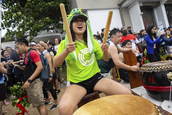 A drummer takes part in the Stanley International Dragon Boat Championships to celebrate the Dragon Boat Festival in Hong Kong, Saturday, May 31, 2025. (AP Photo/Chan Long Hei)