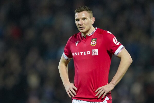 From 'Deadpool' cameo to outcast: Paul Mullin's fall at Wrexham underlines club's growing status | AP News