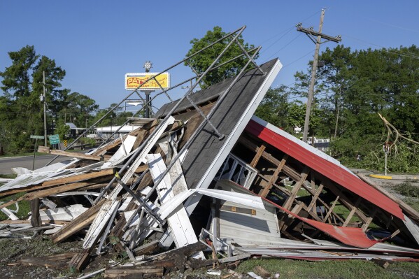The decorative lighthouse is destroyed following Monday nights storm at Pat's Fisherman's Wharf restaurant, dance hall and hotel Tuesday, May 14, 2024 in Henderson, La. (Leslie Westbrook/The Times-Picayune/The New Orleans Advocate via AP)