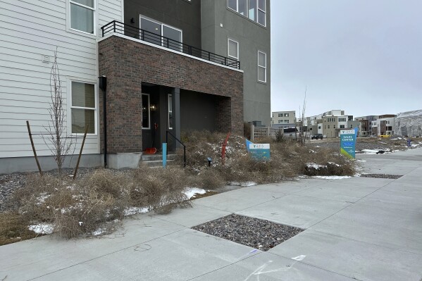 Tumbleweeds appear in front of a building in South Jordan, Utah, on Tuesday, March 5, 2024. The suburb of Salt Lake City was inundated with tumbleweeds after a weekend storm brought stiff winds to the area. The gnarled icon of the Old West rolled in over the weekend and kept rolling until blanketing some homes and streets in suburban Salt Lake City. (AP Photo/Brady McCombs)