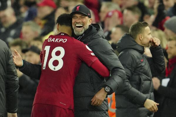 Liverpool's manager Jurgen Klopp celebrates with Liverpool's Cody Gakpo during the English Premier League soccer match between Liverpool and Manchester United at Anfield in Liverpool, England, Sunday, March 5, 2023. (AP Photo/Jon Super)
