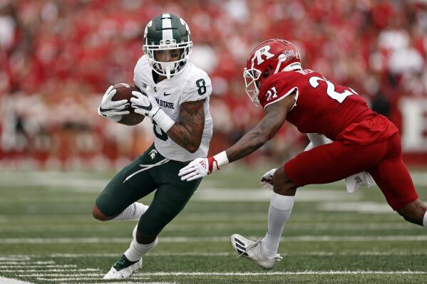 Michigan State wide receiver Jalen Nailor (8) is forced out of bounds by Rutgers defensive back Tre Avery during the first half of an NCAA college football game Saturday, Oct. 9, 2021, in Piscataway, N.J. (AP Photo/Adam Hunger)