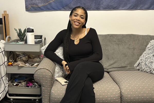 Doreen Malata, 22, a senior at University of Maryland, poses for a photo on Saturday, March 2, 2024, in College Park, Md. The Associated Press spoke with teenagers and young adults about their experiences on social media and what they wish they had known when they first got online. (AP Photo/Almaz Abedje)