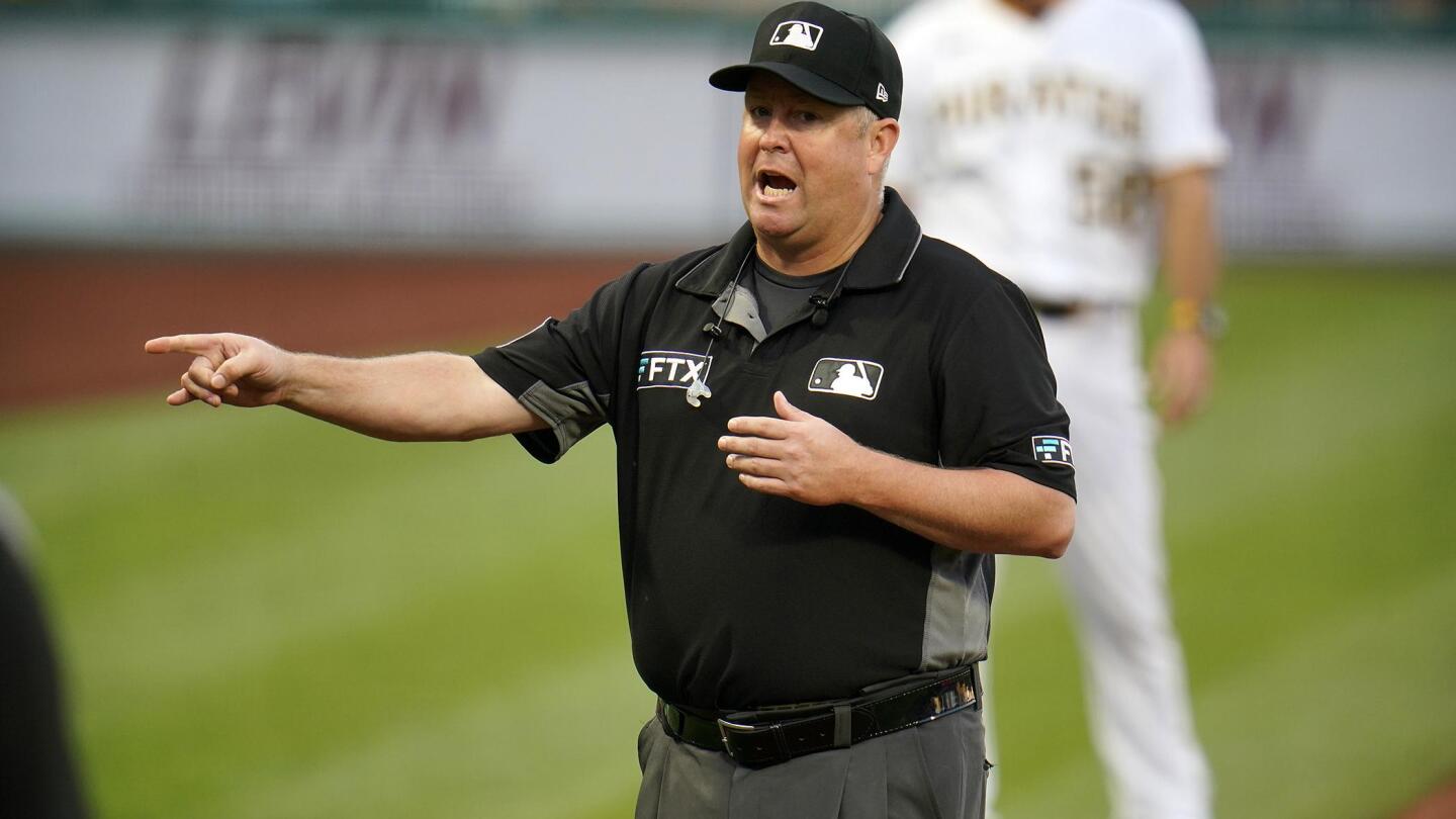 Beyond the grunt: Umpires mic up, and baseball changes a bit | AP News