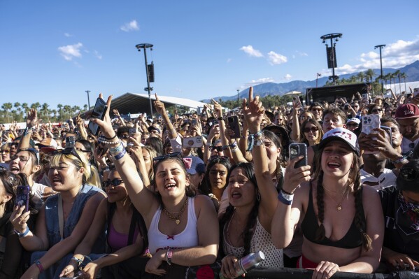 Festivalgoers attend the first weekend of the Coachella Valley Music and Arts Festival at the Empire Polo Club on Sunday, April 14, 2024, in Indio, Calif. (Photo by Amy Harris/Invision/AP)