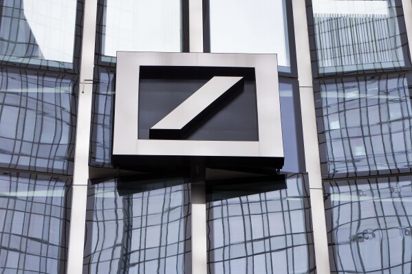 FILE - The Deutsche Bank logo is displayed at a bank's building in Frankfurt, Germany, April 9, 2018. Deutsche Bank, Germany's largest lender, said Thursday, Feb. 1, 2024 it would cut 3,500 jobs as part of efforts to cut costs by 2.5 billion euros through next year and boost profits as the bank benefits from rising global interest rates. (AP Photo/Michael Probst, File)