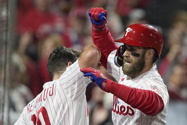 Philadelphia Phillies' Bryce Harper celebrates his two-run home run during the first inning in Game 3 of baseball's World Series between the Houston Astros and the Philadelphia Phillies on Tuesday, Nov. 1, 2022, in Philadelphia. (AP Photo/David J. Phillip)