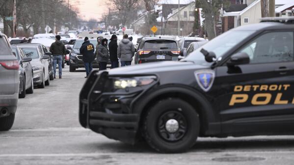 Detroit Police, Michigan State Police and ATF agents work the scene at West McNichols and Log Cabin in Detroit on the border of Highland Park, Mich. on Thursday, Feb. 2, 2023. Authorities searching for three aspiring rappers who have been missing for nearly two weeks have found “multiple bodies” at a vacant Detroit-area apartment building. (Robin Buckson/Detroit News via AP)