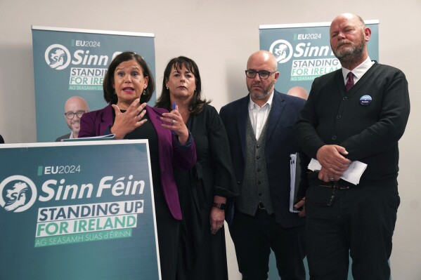 Sinn Fein President Mary Lou McDonald, left, speaks at the launch of the party's manifesto for the European election campaign at Temple Bar Gallery and Studios in Dublin, Thursday, May 30, 2024. (Brian Lawless/PA via AP)