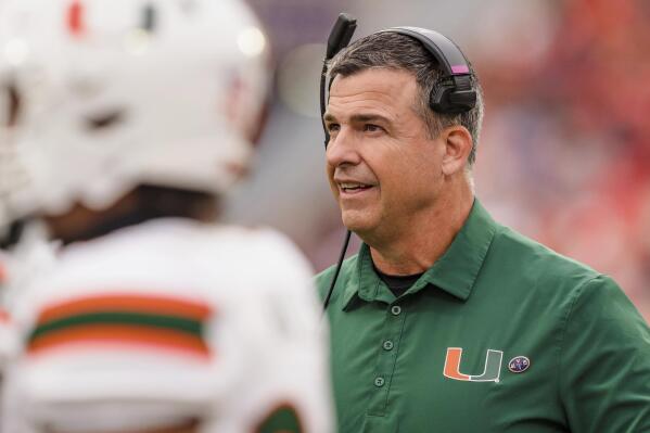 Miami head coach Mario Cristobal looks on in the first half of an NCAA college football game against Clemson on Saturday, Nov. 19, 2022, in Clemson, S.C. (AP Photo/Jacob Kupferman)