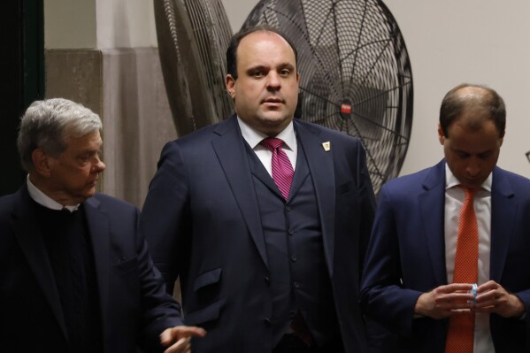 FILE - Boris Epshteyn, advisor to former President Donald Trump, returns to the courtroom after a break in Trump's trial at Manhattan Criminal Court, May 20, 2024, in New York. Lawyers Epshteyn and Jenna Ellis and former U.S. Senate candidate James Lamon on Tuesday, June 18, pleaded not guilty to nine felony charges for their roles in trying to overturn Trump’s Arizona election loss to Joe Biden. (Michael M. Santiago/Pool Photo via AP, File)