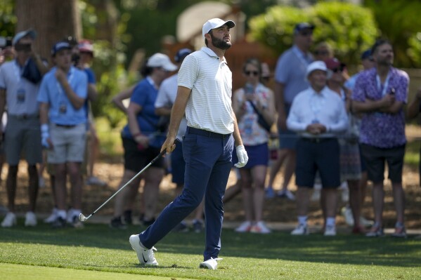 Scottie Scheffler hits from the fairway on the second hole during the first round of the RBC Heritage golf tournament, Thursday, April 18, 2024, in Hilton Head, S.C. (AP Photo/Chris Carlson)