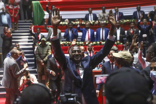 Rapid Support Forces (RSF) deputy commander Abdul Rahim Dagalo, gestures as he arrives for a planned signing ceremony of the Sudan Founding Charter aimed at establishing a unity government involving leaders of political forces, armed groups, and the Rapid Support Forces (RSF) at the Kenyatta International Convention Centre (KICC) in Nairobi, Tuesday, Feb. 18, 2025. (AP Photo/Andrew Kasuku)