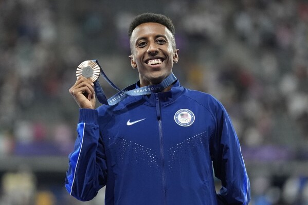 Bronze medalist Yared Nuguse, of the United States, poses on the podium after the men's 1500-meter final 2024 Summer Olympics, Aug. 6, 2024, in Saint-Denis, France. (AP Photo/Matthias Schrader, File)