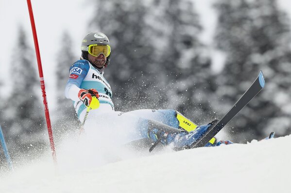 United States' Benjamin Ritchie loses his balance during an alpine ski, men's World Cup slalom, in Lenzerheide, Switzerland, Sunday, March 21, 2021. (AP Photo/Gabriele Facciotti)