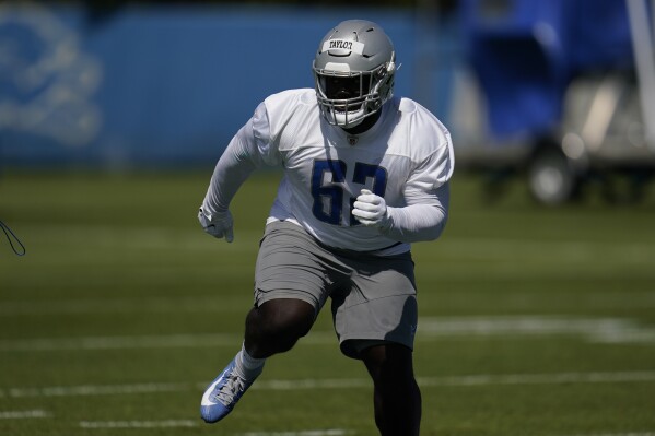 FILE - Detroit Lions defensive lineman Demetrius Taylor works out during an NFL football practice in Allen Park, Mich., Saturday, May 14, 2022. The NFL suspended three players indefinitely Thursday, June 29, 2023, for violating the league's gambling policy and a fourth was sidelined for six games. Isaiah Rodgers and Rashod Berry of the Indianapolis Colts along with free agent Demetrius Taylor received indefinite suspensions through at least this season for betting on NFL games in 2022.(AP Photo/Paul Sancya, File)