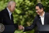 FILE - U.S. President Joe Biden, left, shakes hands with Japan's Prime Minister Fumio Kishida during a joint news conference with South Korean President Yoon Suk Yeol, not visible, on Aug. 18, 2023, at Camp David, the presidential retreat, near Thurmont, Md. Japan and the United States on Wednesday, May 15, 2024 signed an arrangement to jointly develop a new type of missile defense system as the allies seek to defend against the growing threat of hypersonic weapons, which are possessed by China and Russia and being tested by North Korea. (AP Photo/Andrew Harnik, File)
