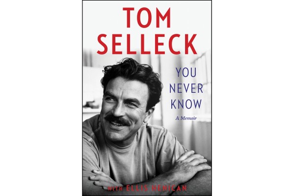 This cover image released by Dey Street Books shows "You Never Know" a memoir by Tom Selleck with Ellis Henican. (Dey Street Books via AP)