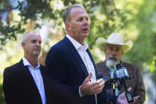 Former San Diego Mayor and Republican candidate for governor, Kevin Faulconer, speaks about his plan to prevent wildfires during a press conference at Capitol Park in Sacramento, Calif., on Tuesday, July 13, 2021. Faulconer says he'd declare a state of emergency over California wildfires on his first day in office as he works to put the state on "war footing" to prevent worsening blazes. Faulconer released his one-page wildfire plan Tuesday amid days of scorching temperatures and fires across the U.S. West. (Sara Nevis/The Sacramento Bee via AP)