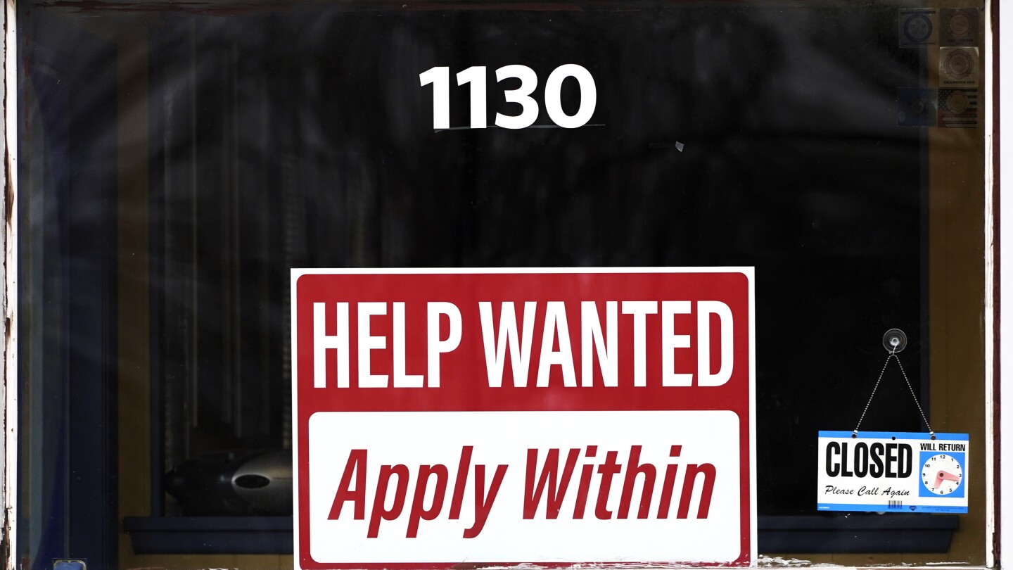 The number of Americans filing for jobless benefits falls as labor market remains sturdy
