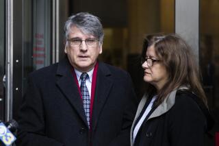 FILE — In this Nov. 21, 2017, file photo, Neurologist Dr. Ricardo Cruciani walks from the center for criminal justice, in Philadelphia, after pleading guilty to misdemeanor charges that he groped women at a clinic. A federal indictment unsealed Wednesday, Oct. 20, 2021, charged Cruciani with sexually abusing multiple patients that he induced to travel to his offices in Manhattan, Philadelphia and Hopewell, N.J. (AP Photo/Matt Rourke, File)