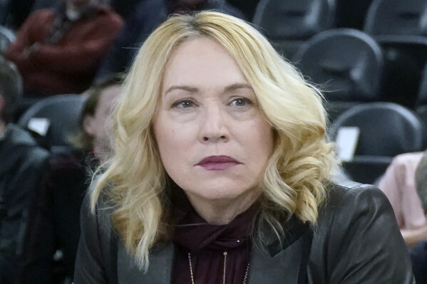 FILE - ESPN's Doris Burke looks on before the start of an NBA basketball game between the Utah Jazz and Golden State Warriors Wednesday, Feb. 9, 2022, in Salt Lake City. Burke will become the first woman to serve as a game analyst on television for a championship final in one of the four major professional U.S. sports leagues on Thursday night, June 6, 2024, when the Dallas Mavericks meet the Boston Celtics in Game 1 of the NBA Finals. (AP Photo/Rick Bowmer, File)