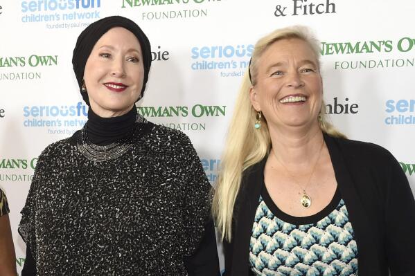 FILE — Susan Newman, left, and Nell Newman arrive at the SeriousFun Children's Network event at the Dolby Theatre, May 14, 2015, in Los Angeles. A new lawsuit filed Tuesday, Aug. 23, 2022, has exposed a deep rift between two of Paul Newman's daughters and the late actor's charitable foundation, over how it gives away some of the millions of dollars it makes off the Newman's Own line of food and drink products. (Photo by Chris Pizzello/Invision/AP, File)