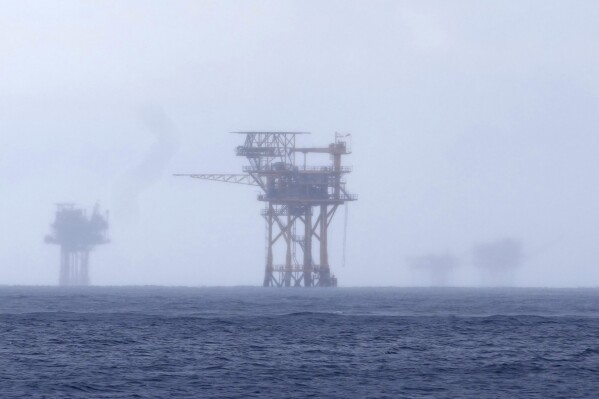 Oil rigs visible through fog near Flower Garden Banks National Marine Sanctuary in the Gulf of Mexico, off the coast of Galveston, Texas, Saturday, September 10, 2019. November 16, 2023. (AP Photo/LM Otero)