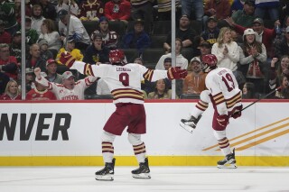 Boston College forward Cutter Gauthier (19) celebrates after scoring against Michigan during the second period of a Frozen Four semifinal in the men's NCAA college hockey tournament Thursday, April 11, 2024, in St. Paul, Minn. (AP Photo/Abbie Parr)