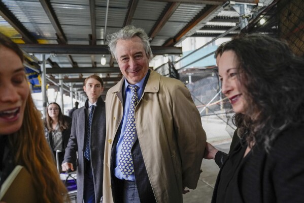 Former Rock & Roll Hall of Fame curator Craig Inciardi smiles as he leaves court, Wednesday, March 6, 2024, in New York. New York prosecutors abruptly dropped their criminal case midtrial Wednesday against three men who had been accused of conspiring to possess a cache of hand-drafted lyrics to 