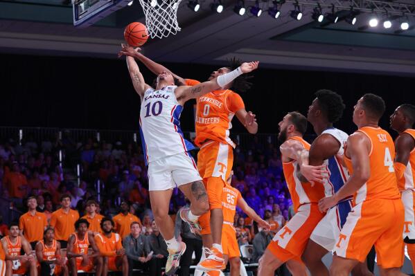 In a photo provided by Bahamas Visual Services, Kansas' Jalen Wilson shoots against Tennessee's Jonas Aidoo (0) during an NCAA college basketball game in the Battle 4 Atlantis at Paradise Island, Bahamas, Friday, Nov. 25, 2022. (Tim Aylen/Bahamas Visual Services via AP)