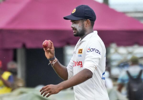 Sri Lankan bowler Ramesh Mendis acknowledges after taking six West Indian wickets during the day three of their second test cricket match in Galle, Sri Lanka, Wednesday, Dec. 1, 2021. (AP Photo/Eranga Jayawardena)