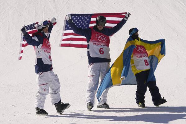 From left silver medal winner United State's Nick Goepper, gold medal winner United States' Alexander Hall and bronze medal winner Sweden's Jesper Tjader celebrate afrter the men's slopestyle finals at the 2022 Winter Olympics, Wednesday, Feb. 16, 2022, in Zhangjiakou, China. (AP Photo/Francisco Seco)