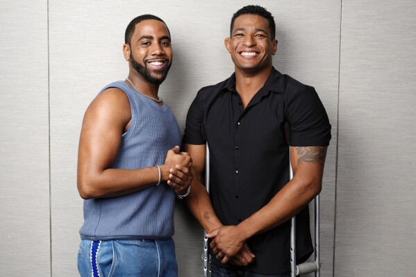 Jharrel Jerome, left, the star of "Unstoppable," and the film's subject Anthony Robles pose together during the Toronto International Film Festival, Friday, Sept. 6, 2024, in Toronto. (AP Photo/Chris Pizzello)