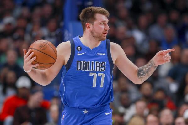 Dallas Mavericks point guard Luka Doncic (77) instructs the offense during the second half of an NBA basketball game against the Denver Nuggets, Friday, Nov. 18, 2022, in Dallas. (AP Photo/Gareth Patterson)