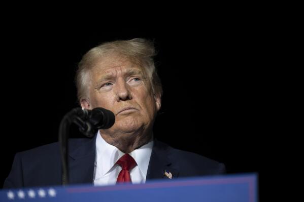 Former President Donald Trump pauses while speaking at a rally at the Minden Tahoe Airport in Minden, Nev., Saturday, Oct. 8, 2022. (AP Photo/José Luis Villegas, Pool)