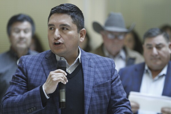Democratic state Rep. Derrick Lente of Sandia Pueblo speaks in Santa Fe, New Mexico, on Friday, Jan. 5, 2024, about tax relief and budget proposals in advance of a 30-day legislative session. The Democratic-led legislature convenes Jan. 16 amid a multibillion-dollar budget surplus to address concerns about education, gun violence, affordable housing and childhood wellbeing in an election years for House and Senate lawmakers. Lente is chairman of the House taxation committee (AP Photo/Morgan Lee)