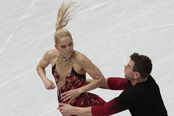 Alexa Knierim and Brandon Frazier, of the United States perform in the pairs short program at the Figure Skating World Championships in Montpellier, south of France, Wednesday, March 23, 2022. (AP Photo/Francisco Seco)