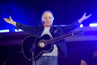 FILE - Paul Simon performs at Global Citizen Live in Central Park on Saturday, Sept. 25, 2021, in New York. “In Restless Dreams: The Music of Paul Simon” premiered Sunday, Sept. 10, 2023, at the Toronto International Film Festival. It is an expansive look at Simon’s decades-spanning career, from growing up in Queens, New York, with Art Garfunkel to the success of “Graceland,” the sensational 1986 album made with South African musicians. (Photo by Evan Agostini/Invision/AP, File)