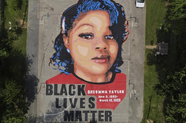 FILE - A ground mural depicting a portrait of Breonna Taylor is seen at Chambers Park in Annapolis, Md., July 6, 2020. The U.S. Justice Department has found Louisville police have engaged in a pattern of violating constitutional rights following an investigation prompted by the fatal police shooting of Taylor. The announcement was made Wednesday, March 8, 2023, by Attorney Merrick Garland. (AP Photo/Julio Cortez, File)
