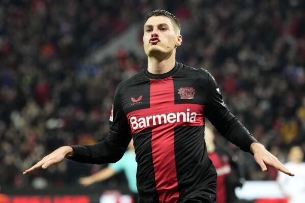 Hat trick, unbeaten record, top spot: Leverkusen stays 4 points clear of  Bayern for Bundesliga break | AP News