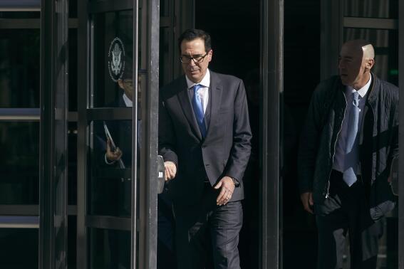 Former United States Secretary of the Treasury, Steven Mnuchin, center, leaves the Brooklyn Federal Court on Thursday, Oct. 20, 2022, in the Brooklyn borough of New York. (AP Photo/Andres Kudacki)