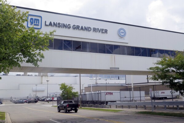 A vehicle enters General Motor’s Lansing Grand River Assembly plant, Tuesday, Sept. 12, 2023, in Lansing, Mich., just days before auto workers could potentially strike due failed contract negotiations. (AP Photo/Joey Cappelletti)