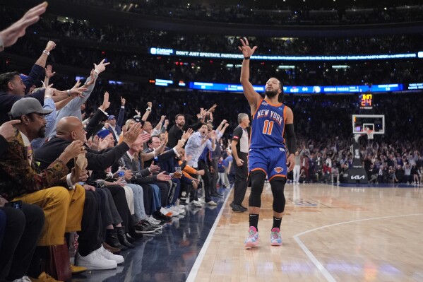 New York Knicks' Jalen Brunson (11) gestures to fans after making a three-point shot during the second half of Game 5 in an NBA basketball second-round playoff series against the Indiana Pacers, Tuesday, May 14, 2024, in New York. The Knicks won 121-91. (AP Photo/Frank Franklin II)