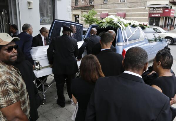 FILE - In this June 16, 2015 file photo, the casket bearing Kalief Browder is loaded into a hearse after his funeral service in the Bronx borough of New York. Two years into New York's bold quest to eliminate pretrial incarceration for most crimes, state officials are considering abandoning some bail reforms, and locking up more people upon arrest — amid public pressure to curb rising violence. Browder spent three years at New York City's notorious Rikers Island jail complex — including nearly two years in solitary confinement — before eventually being released without trial. He later killed himself. (AP Photo/Frank Franklin II, File)