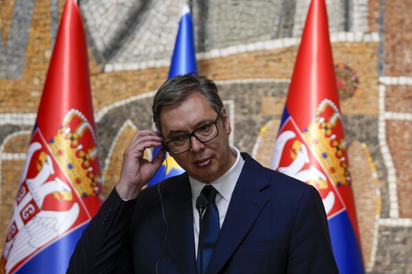 Serbian President Aleksandar Vucic listens to Hungarian Prime Minister Viktor Orban during a press conference after talks at the Serbia Palace in Belgrade, Serbia, Friday, Sept. 29, 2023. Orban is on a one day visit to Serbia. (AP Photo/Darko Vojinovic)